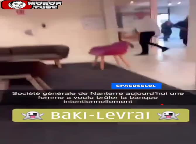 Video :She poses in front of a bank in France and attempts to set it on fire